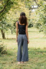 model wearing hem pants denim sula high waisted denim pants