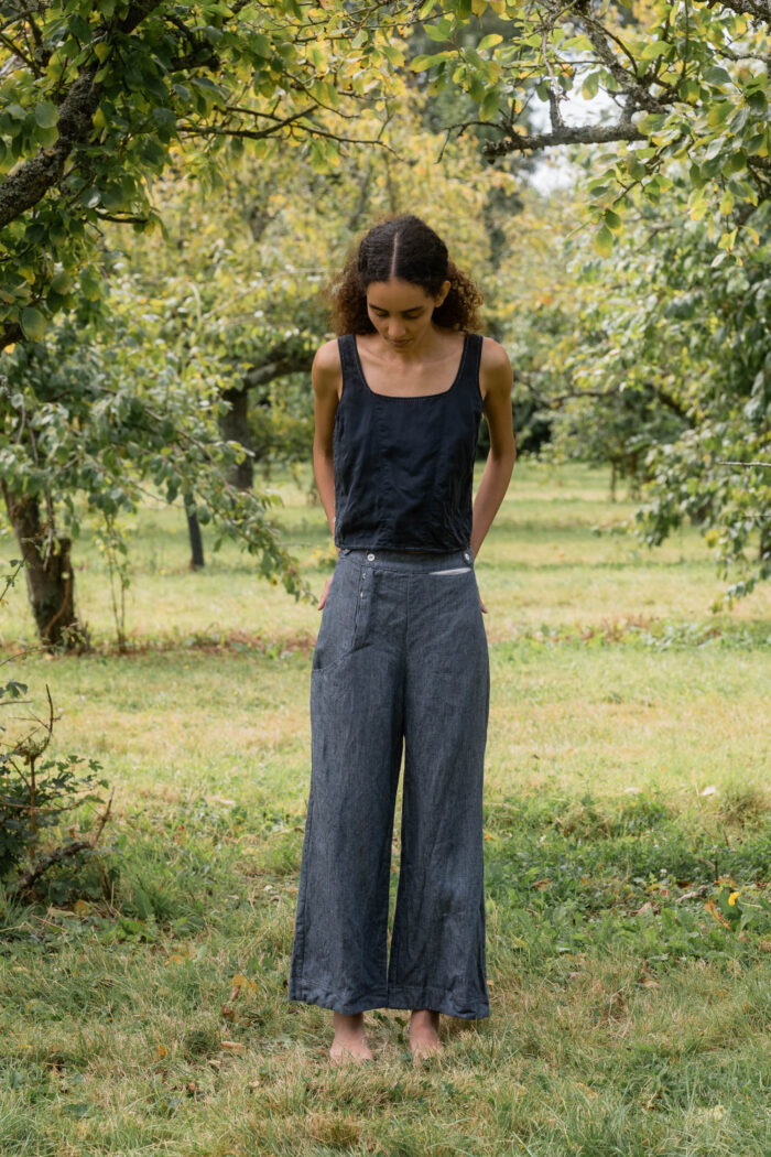model wearing hem pants denim sula high waisted denim pants