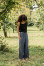 model wearing hem pants denim sula high waisted denim pants