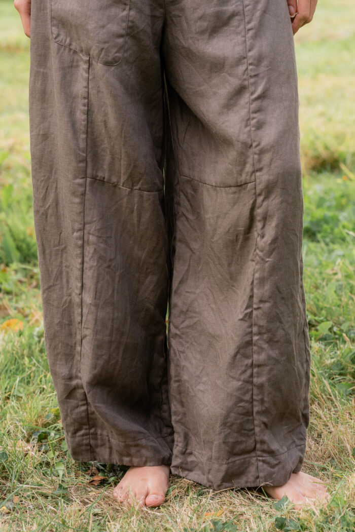model wearing tailored line pants linen sula linen barrel leg trousers