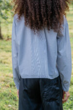 model wearing puckered collar shirt tiny check