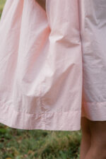 model wearing gathered dress tiny check sula oversize check dress