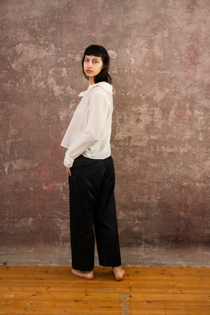 model wearing frill blouse sula blouse with frill collar