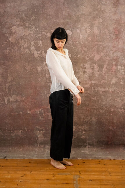 model wearing frill blouse sula blouse with frill collar