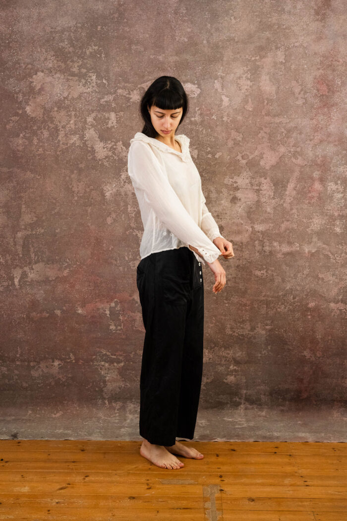 model wearing frill blouse sula blouse with frill collar