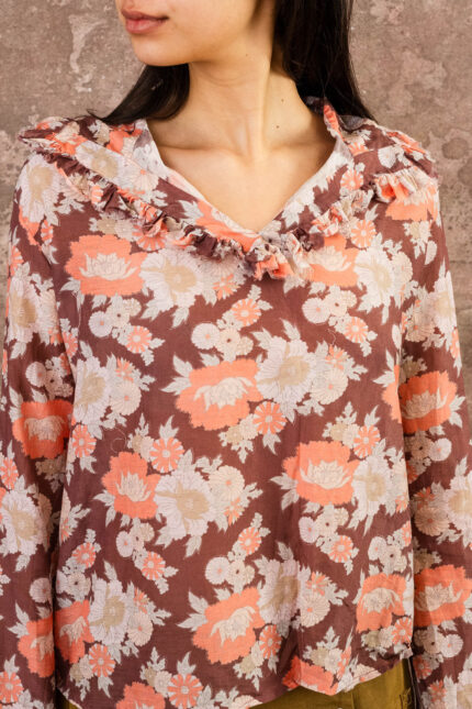 model wearing frill blouse sula flower print frill blouse