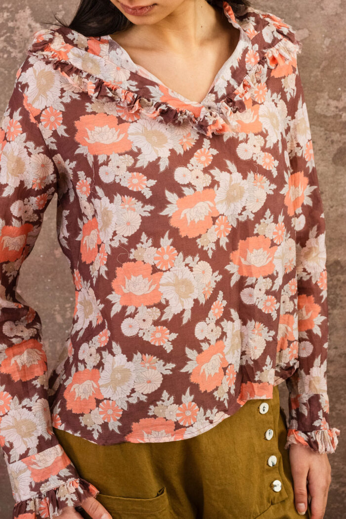 model wearing frill blouse sula flower print frill blouse