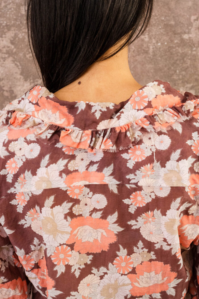 model wearing frill blouse sula flower print frill blouse