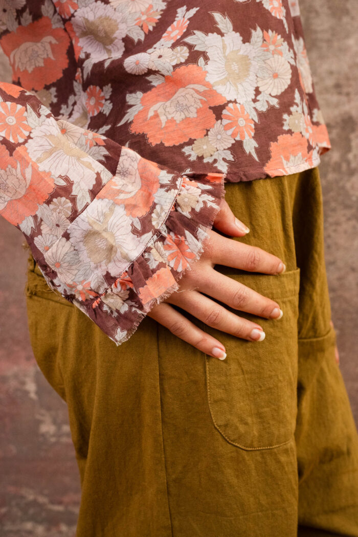 model wearing frill blouse sula flower print frill blouse